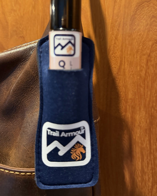 Close up of a Trail Armour QUENCH roller in a navy neoprene lip balm holder